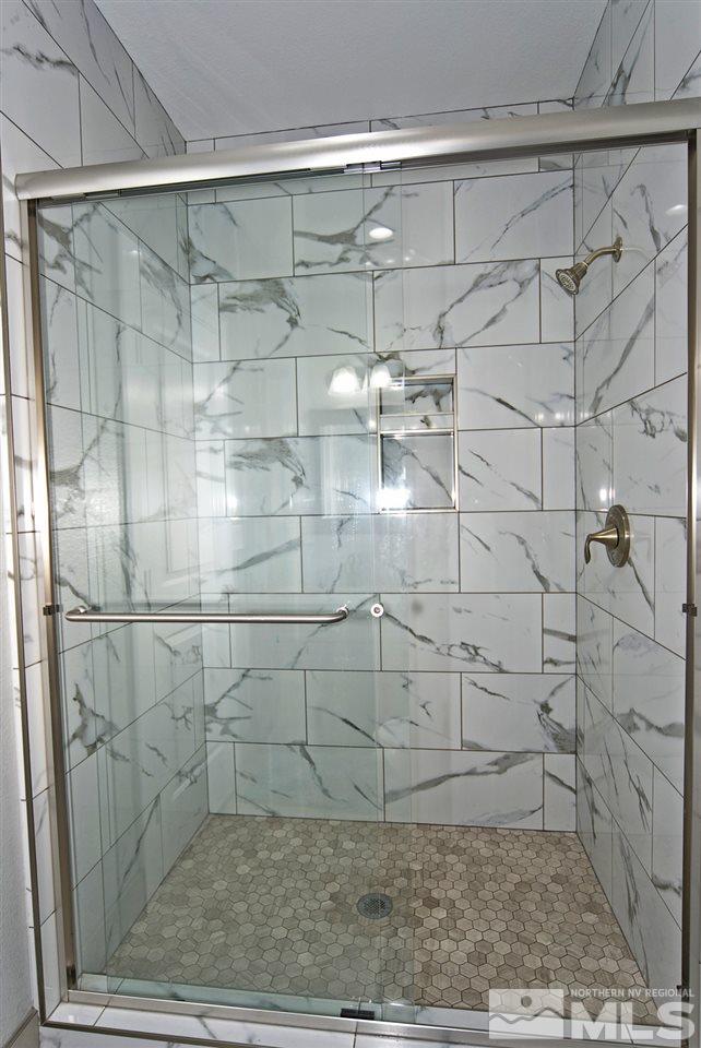 1375 Freds Mountain Road Reno, NV 89508 - Photo 25 of 40 a bathroom with a shower