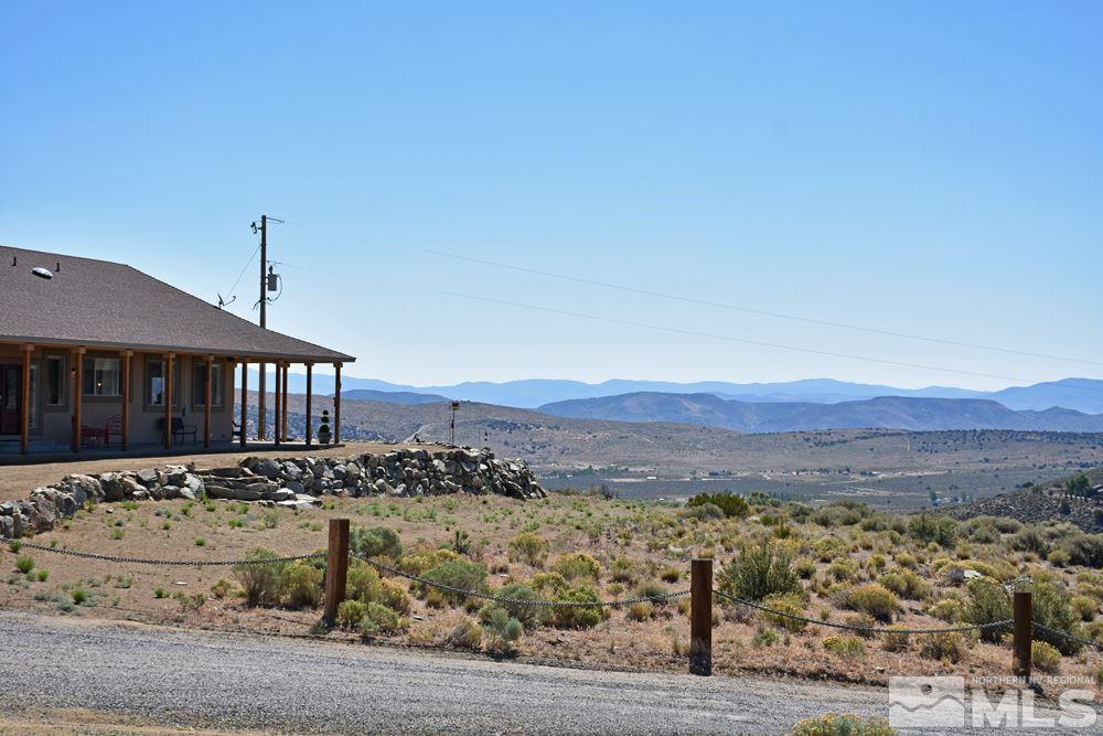 1375 Freds Mountain Road Reno, NV 89508 - Photo 26 of 40 a view of a house with a yard