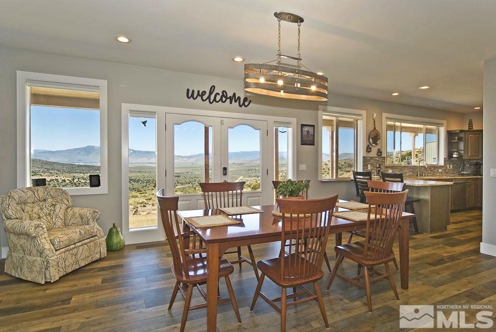1375 Freds Mountain Road Reno, NV 89508 - Photo 5 of 40 a view of a dining room with furniture window and wooden floor