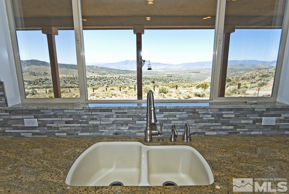 1375 Freds Mountain Road Reno, NV 89508 - Photo 9 of 40 a bath tub sitting next to a window