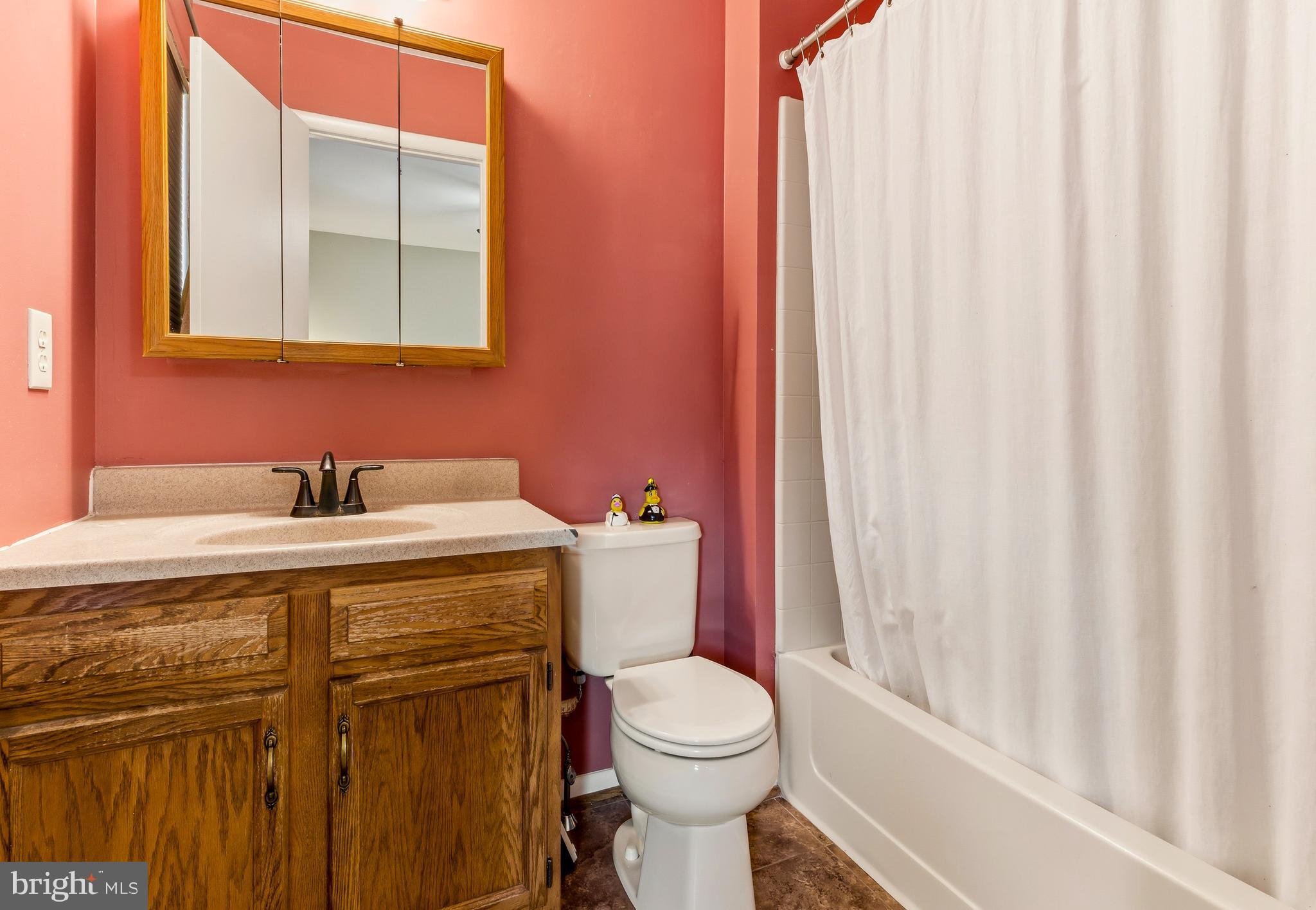 48 Forest Court Mantua, NJ 08051 - Photo 14 of 15 a bathroom with a sink a toilet and a mirror