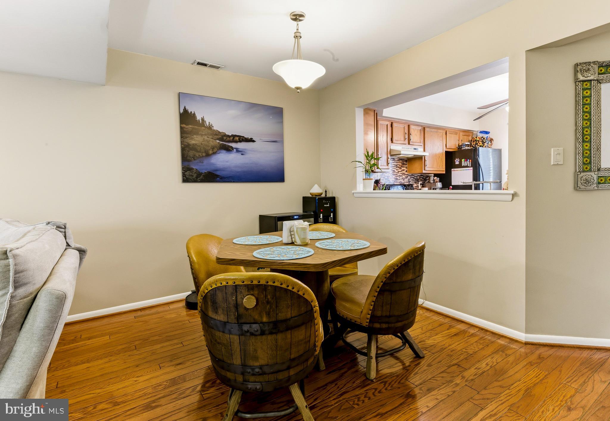 48 Forest Court Mantua, NJ 08051 - Photo 9 of 15 a view of a dining room with furniture wooden floor and chandelier