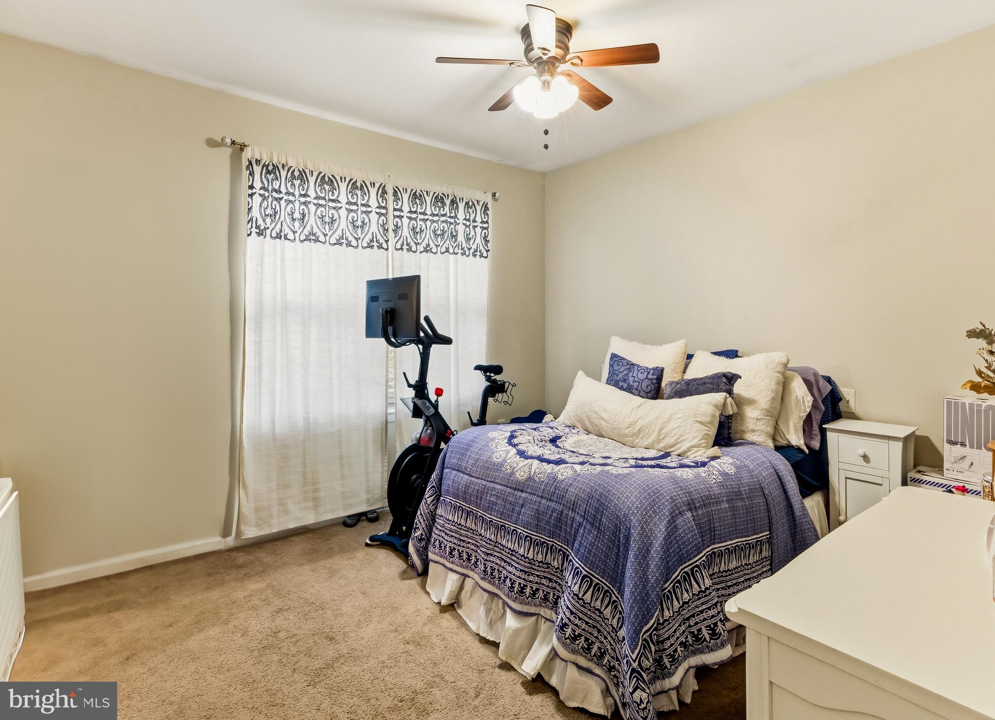 48 Forest Court Mantua, NJ 08051 - Photo 10 of 15 a bedroom with a bed and a chandelier