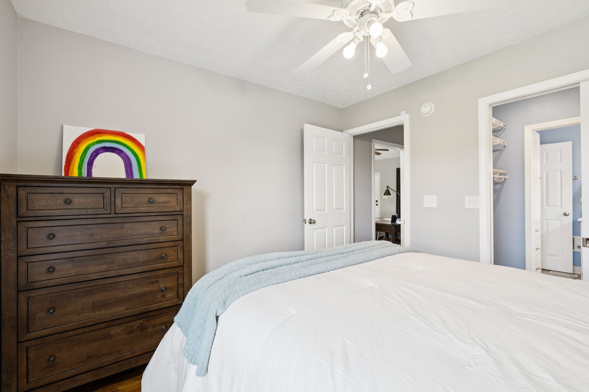 526 Stetson Court Murfreesboro, TN 37128 - Photo 13 of 26 a bedroom with a bed and a chandelier