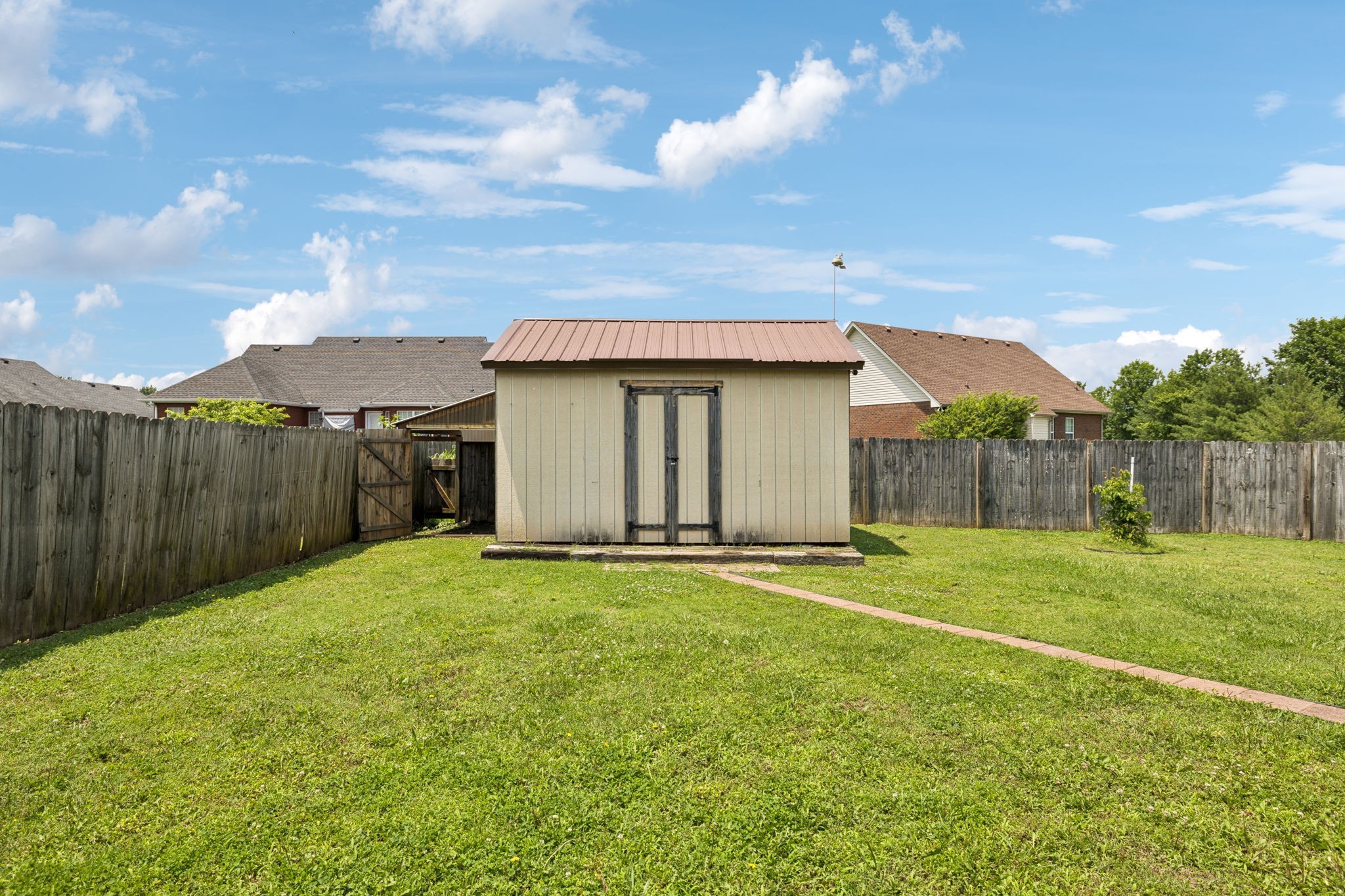 526 Stetson Court Murfreesboro, TN 37128 - Photo 20 of 26 a view of an house with backyard and garden