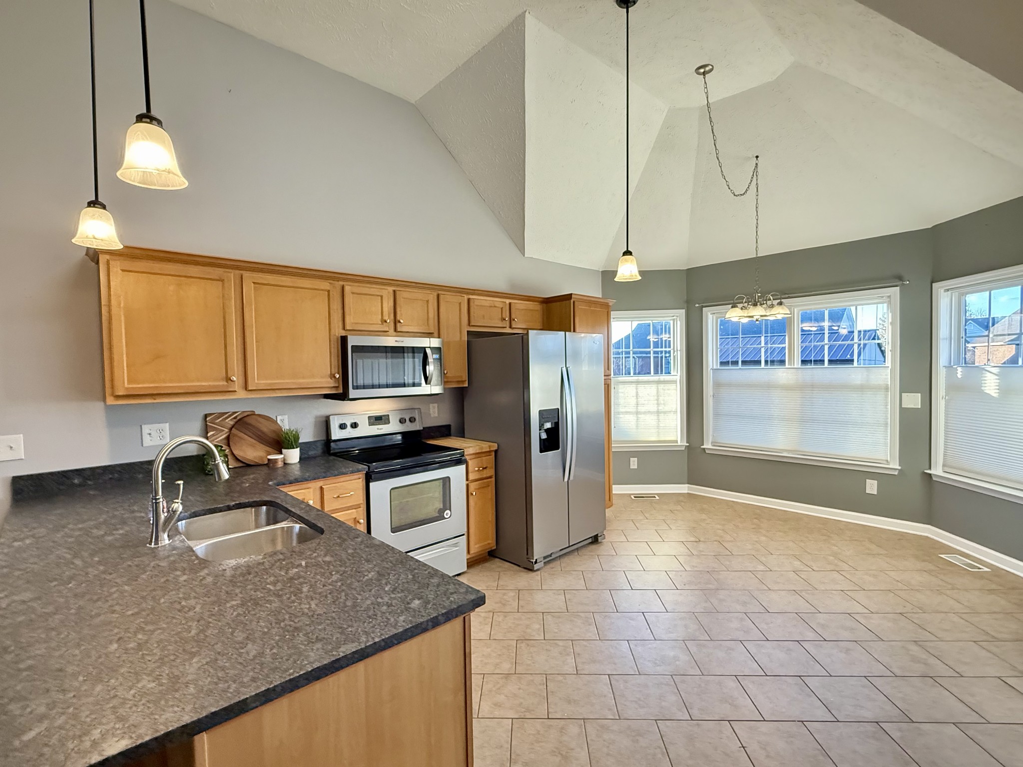 526 Stetson Court Murfreesboro, TN 37128 - Photo 3 of 26 a kitchen with stainless steel appliances granite countertop a sink a stove counter space and cabinets