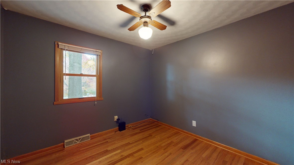 9600 Mennonite Road Wadsworth, OH 44281 - Photo 16 of 35 Bedroom featuring hardwood flooring