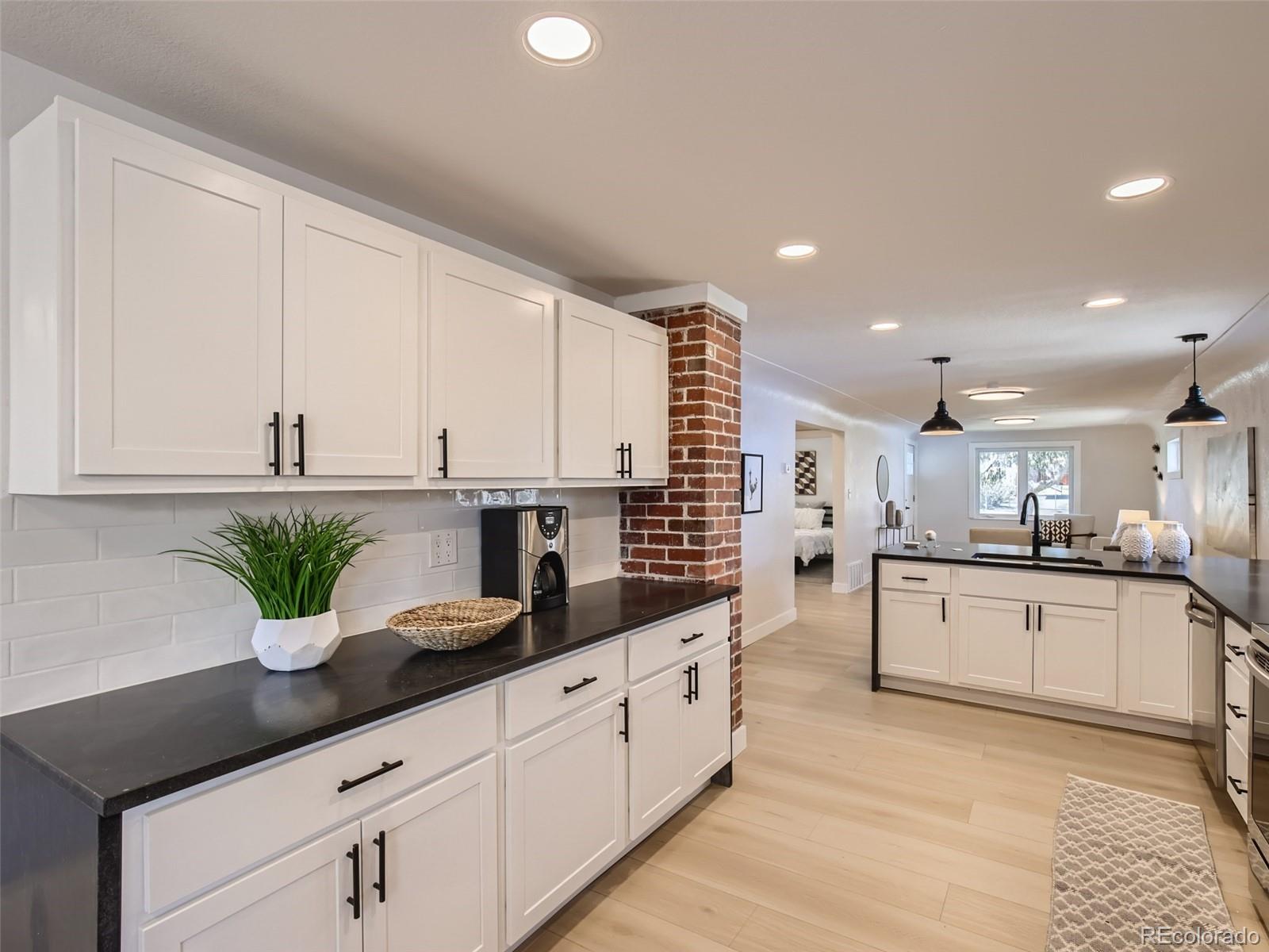 2814 Chase Street Wheat Ridge, CO 80214 - Photo 11 of 28 a kitchen with counter top space and cabinets
