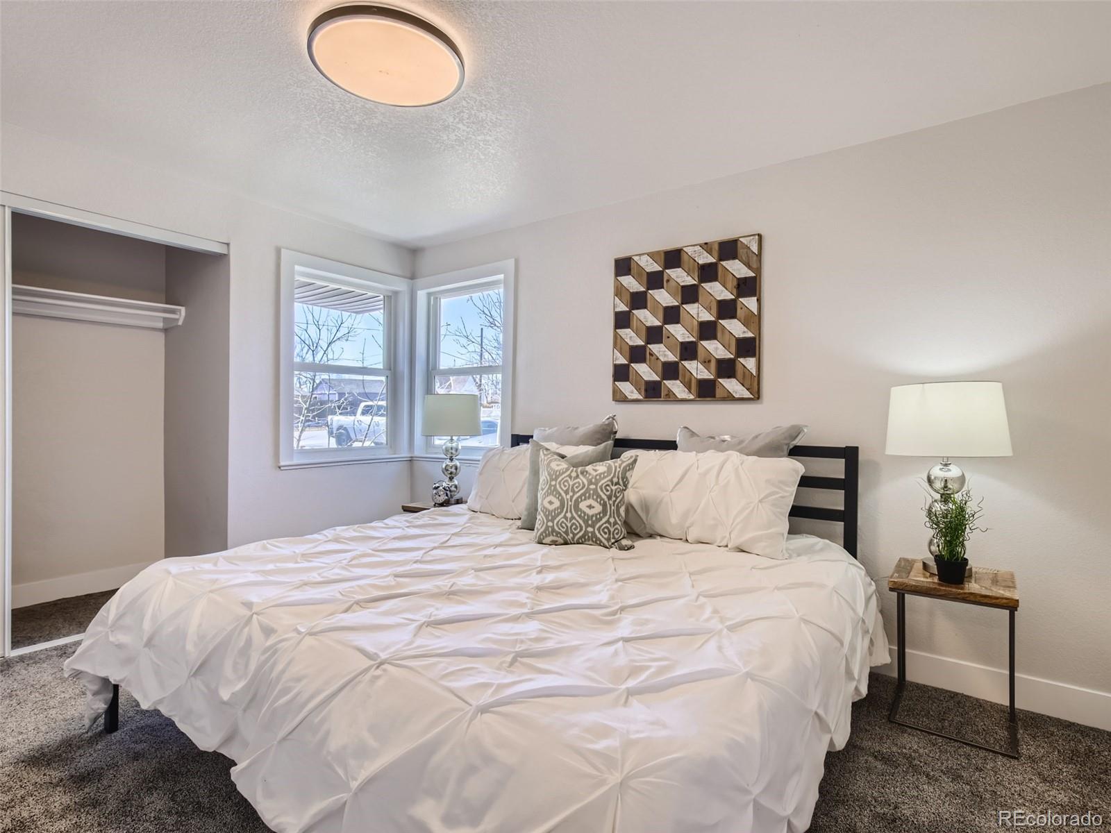 2814 Chase Street Wheat Ridge, CO 80214 - Photo 16 of 28 a bedroom with a bed and a window