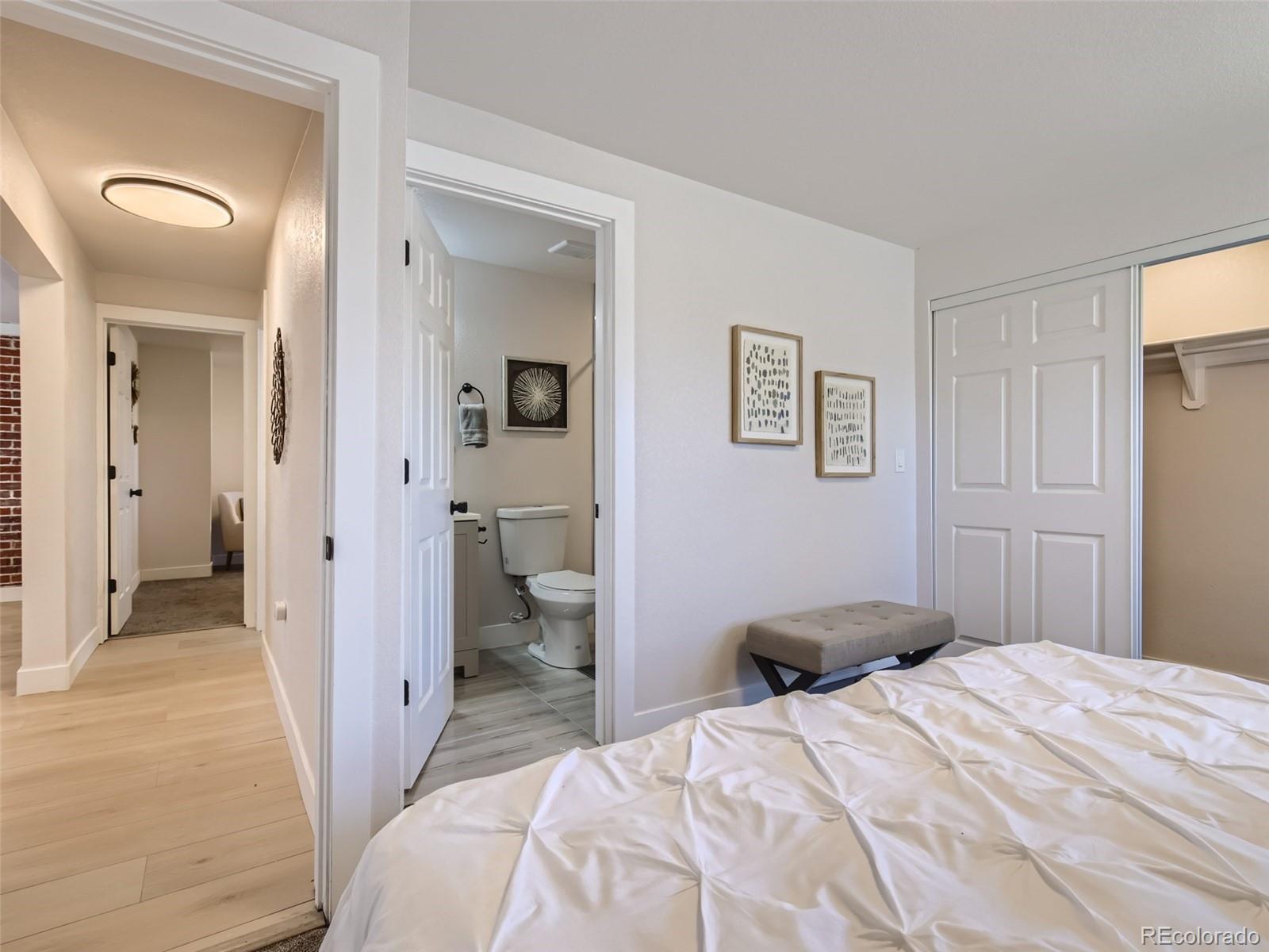 2814 Chase Street Wheat Ridge, CO 80214 - Photo 18 of 28 a bedroom with a bed and a view of bathroom