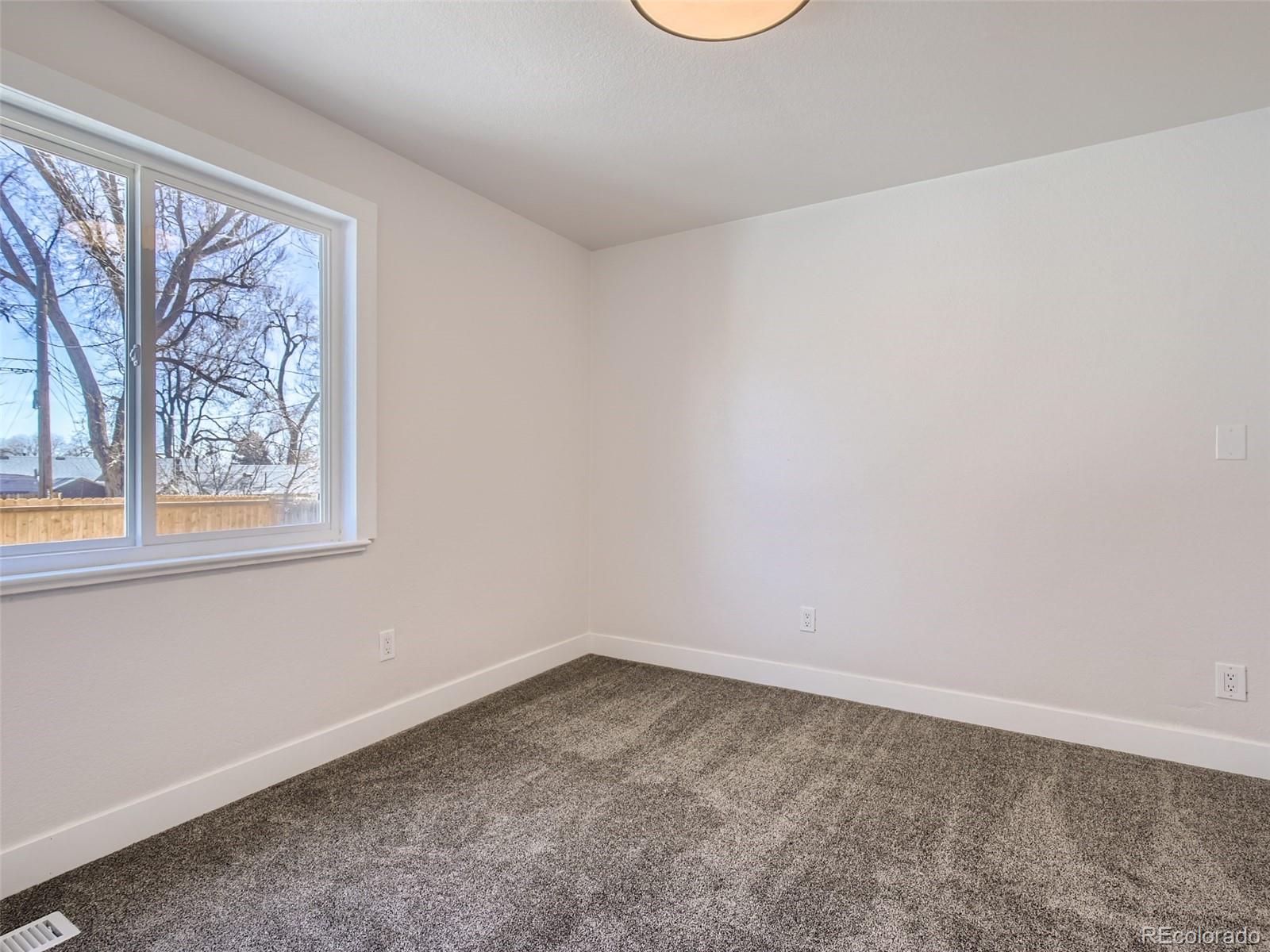 2814 Chase Street Wheat Ridge, CO 80214 - Photo 23 of 28 an empty room with a window