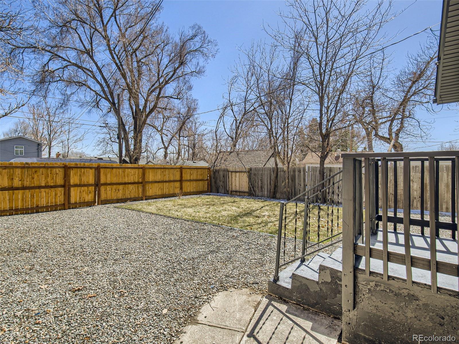 2814 Chase Street Wheat Ridge, CO 80214 - Photo 25 of 28 a view of backyard and tree