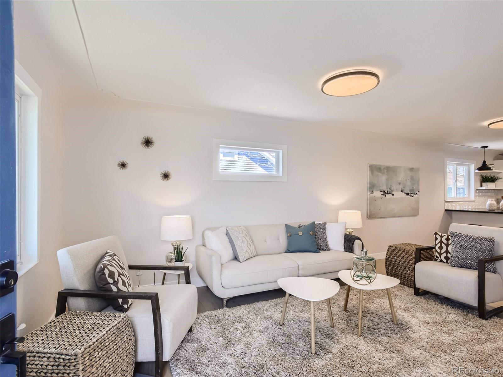 2814 Chase Street Wheat Ridge, CO 80214 - Photo 4 of 28 a living room with furniture and a rug