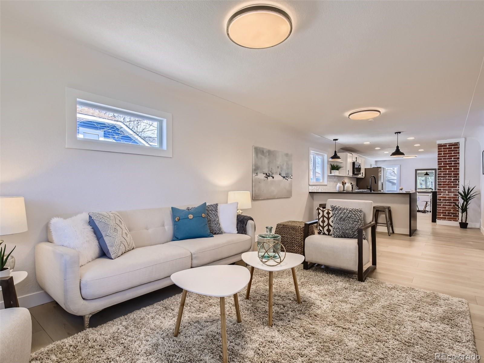 2814 Chase Street Wheat Ridge, CO 80214 - Photo 5 of 28 a living room with furniture and a view