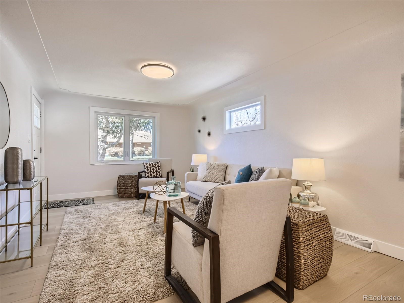 2814 Chase Street Wheat Ridge, CO 80214 - Photo 7 of 28 a living room with furniture and a window