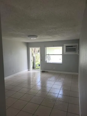 a view of an empty room and window