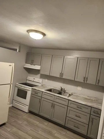 a bathroom with a toilet a sink and bathtub