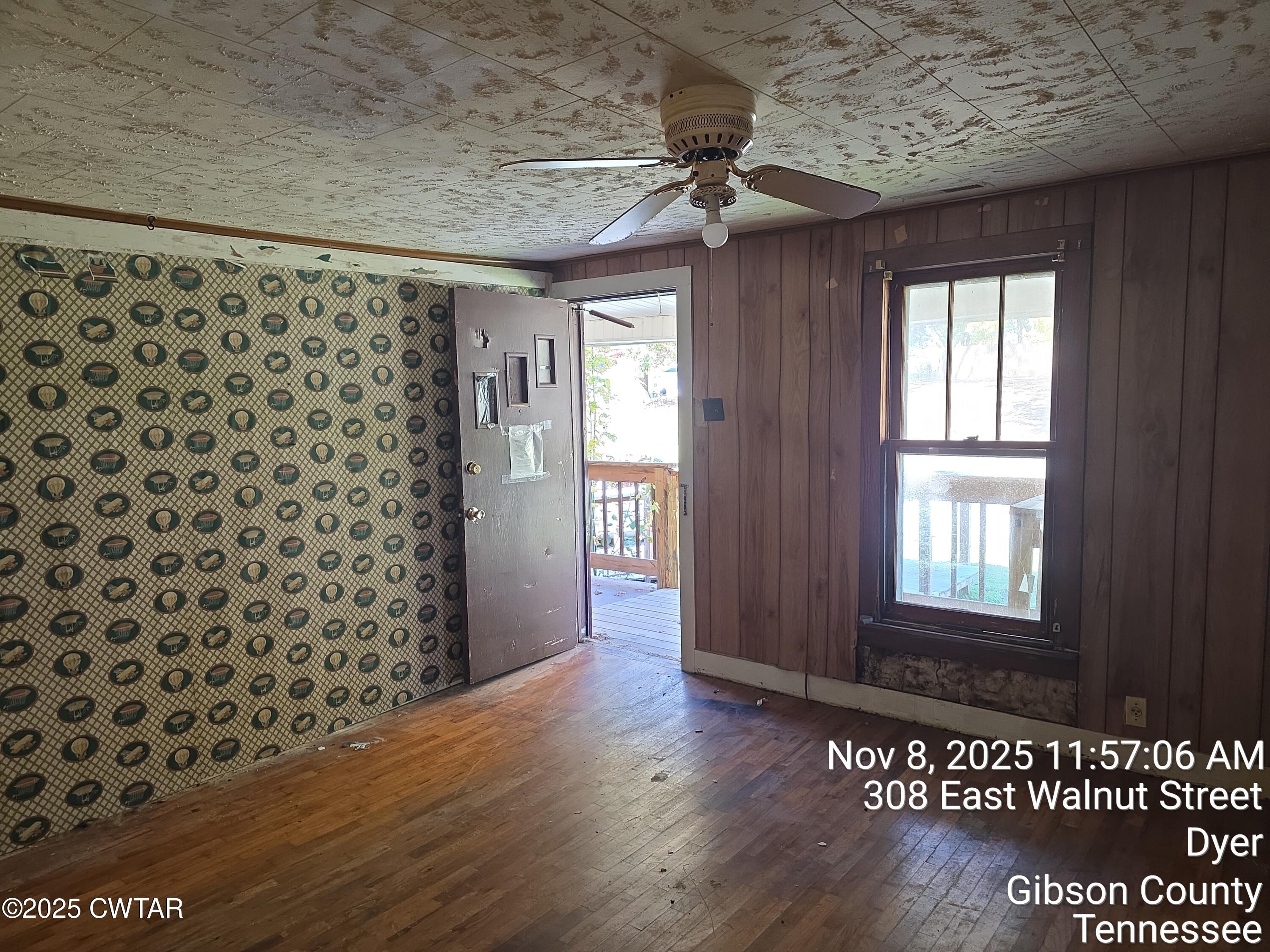 299 East Walnut Street Dyer, TN 38330 - Photo 14 of 41 a view of a livingroom with wooden floor and a window