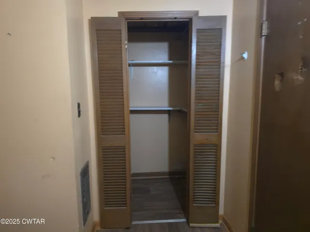 a bathroom with a glass door