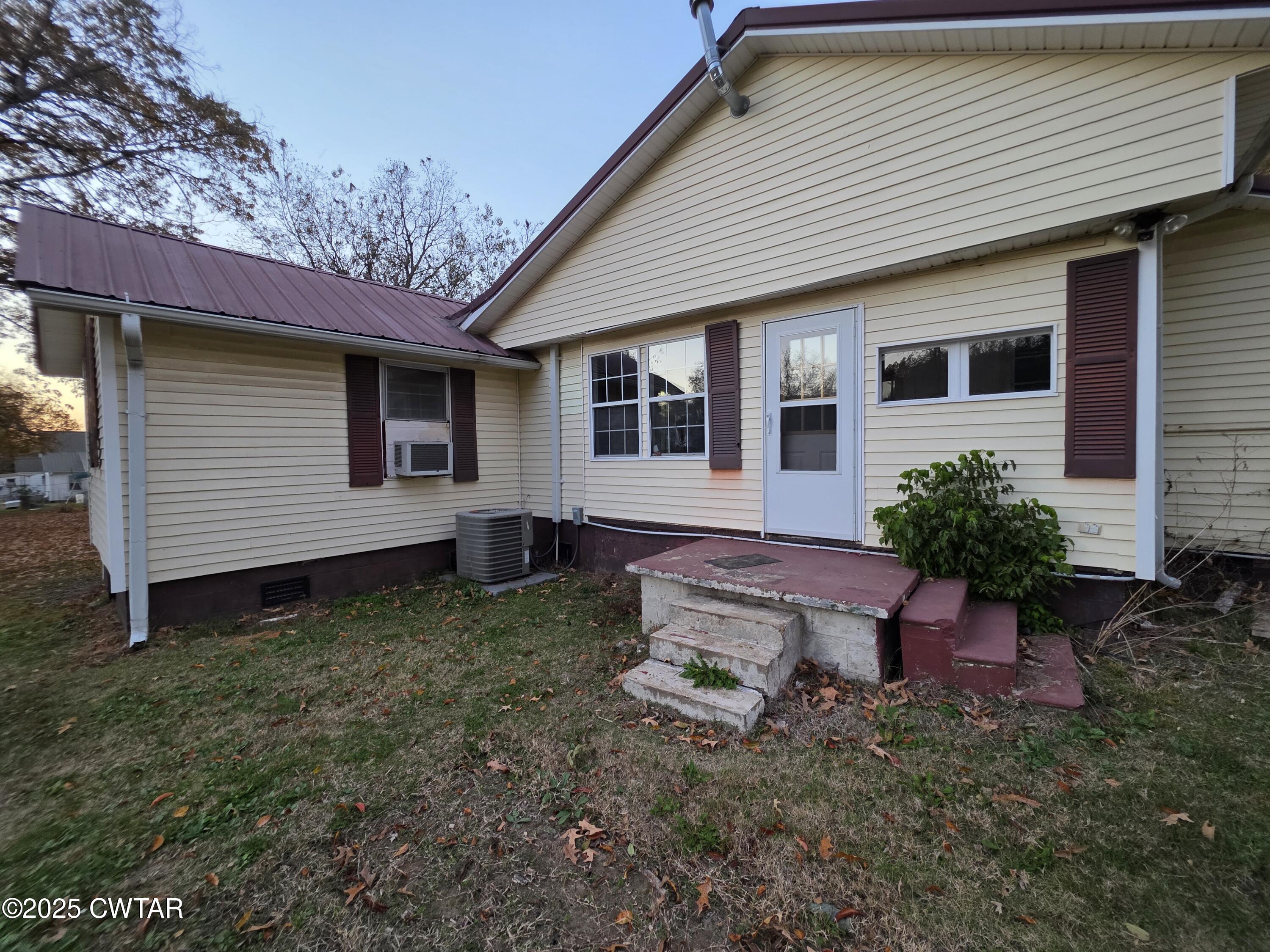 299 East Walnut Street Dyer, TN 38330 - Photo 6 of 41 a backyard of a house with seating space