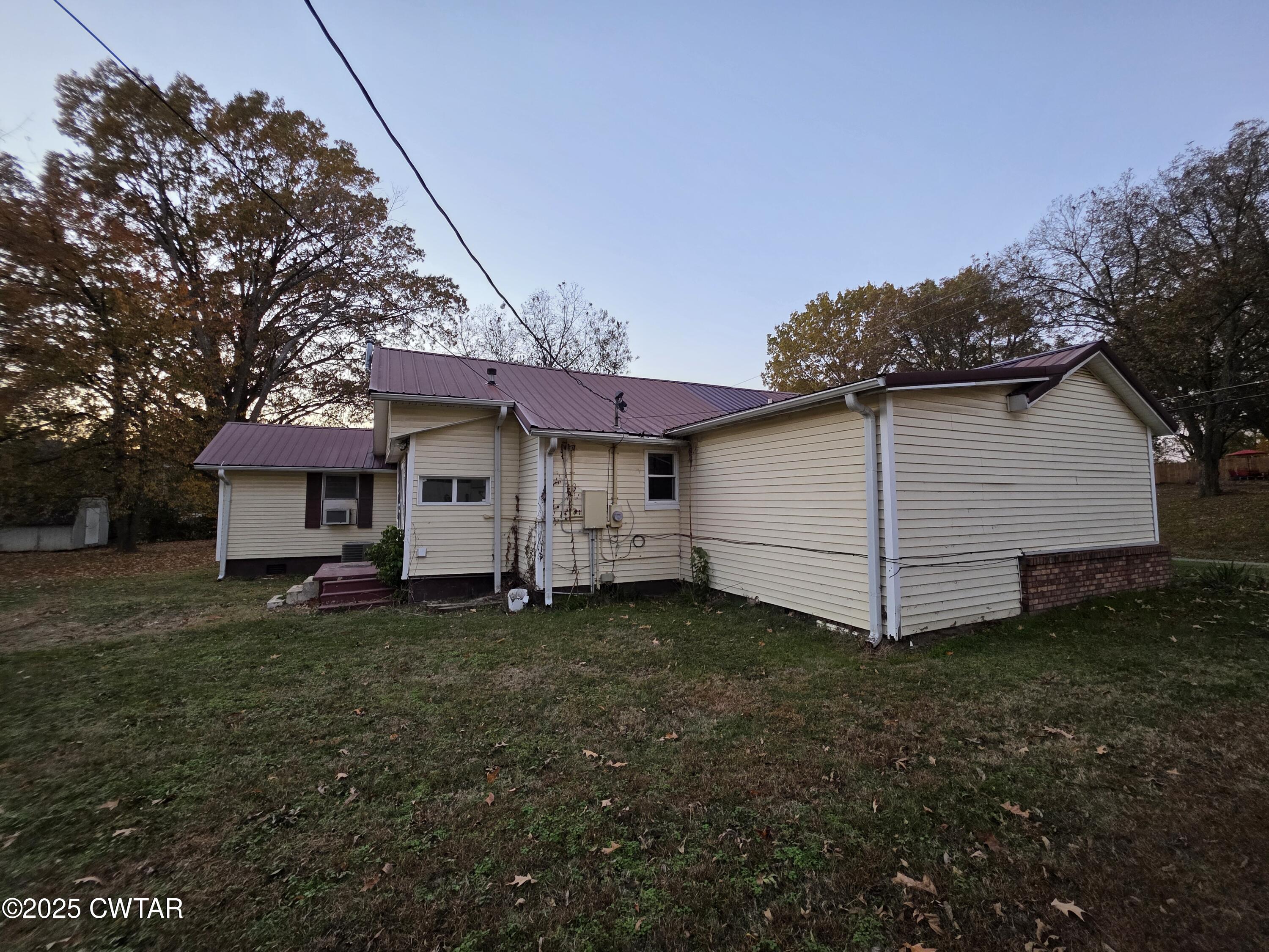 299 East Walnut Street Dyer, TN 38330 - Photo 7 of 41 a view of a house with a yard