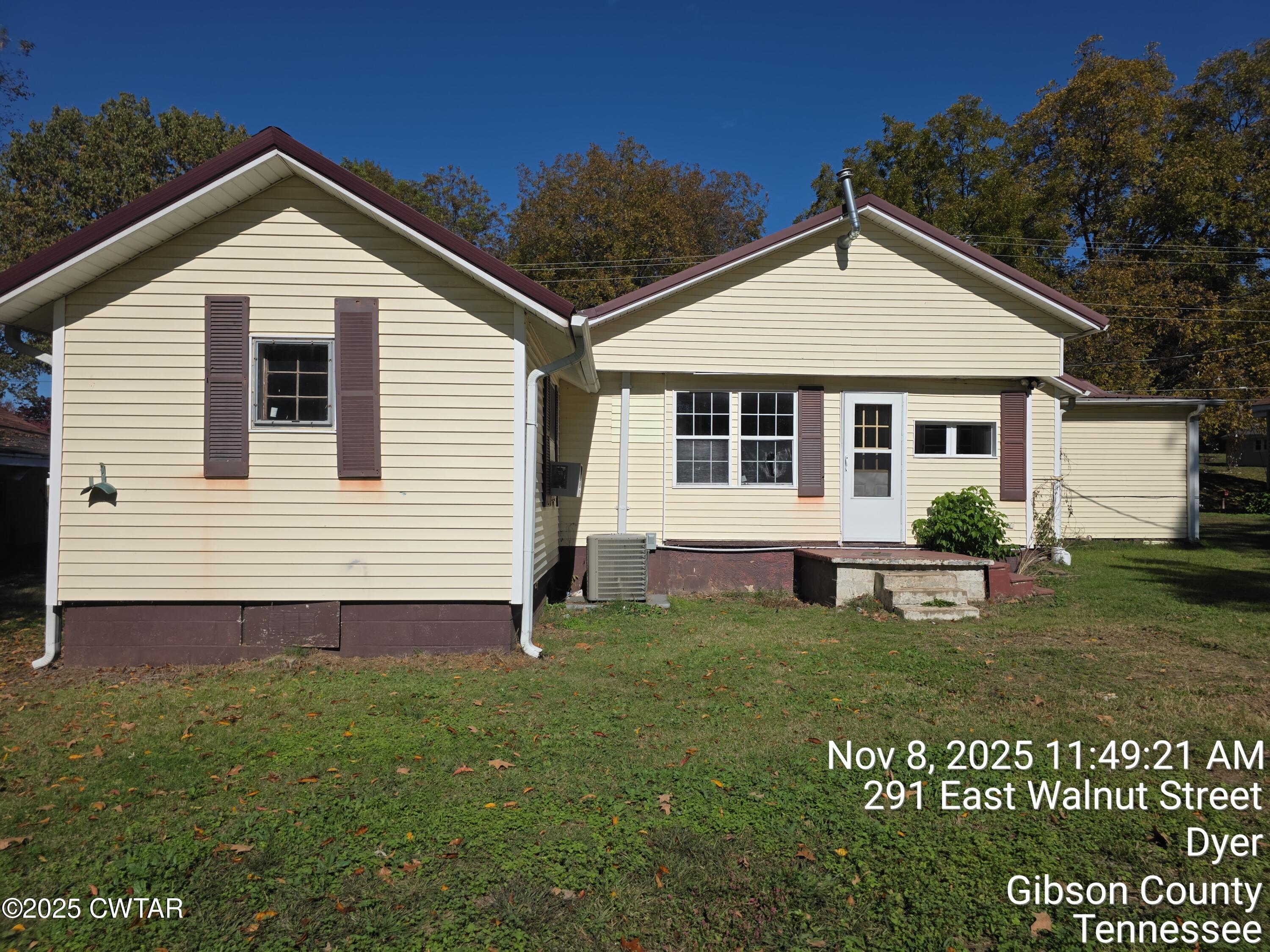 299 East Walnut Street Dyer, TN 38330 - Photo 8 of 41 a view of a house with a yard