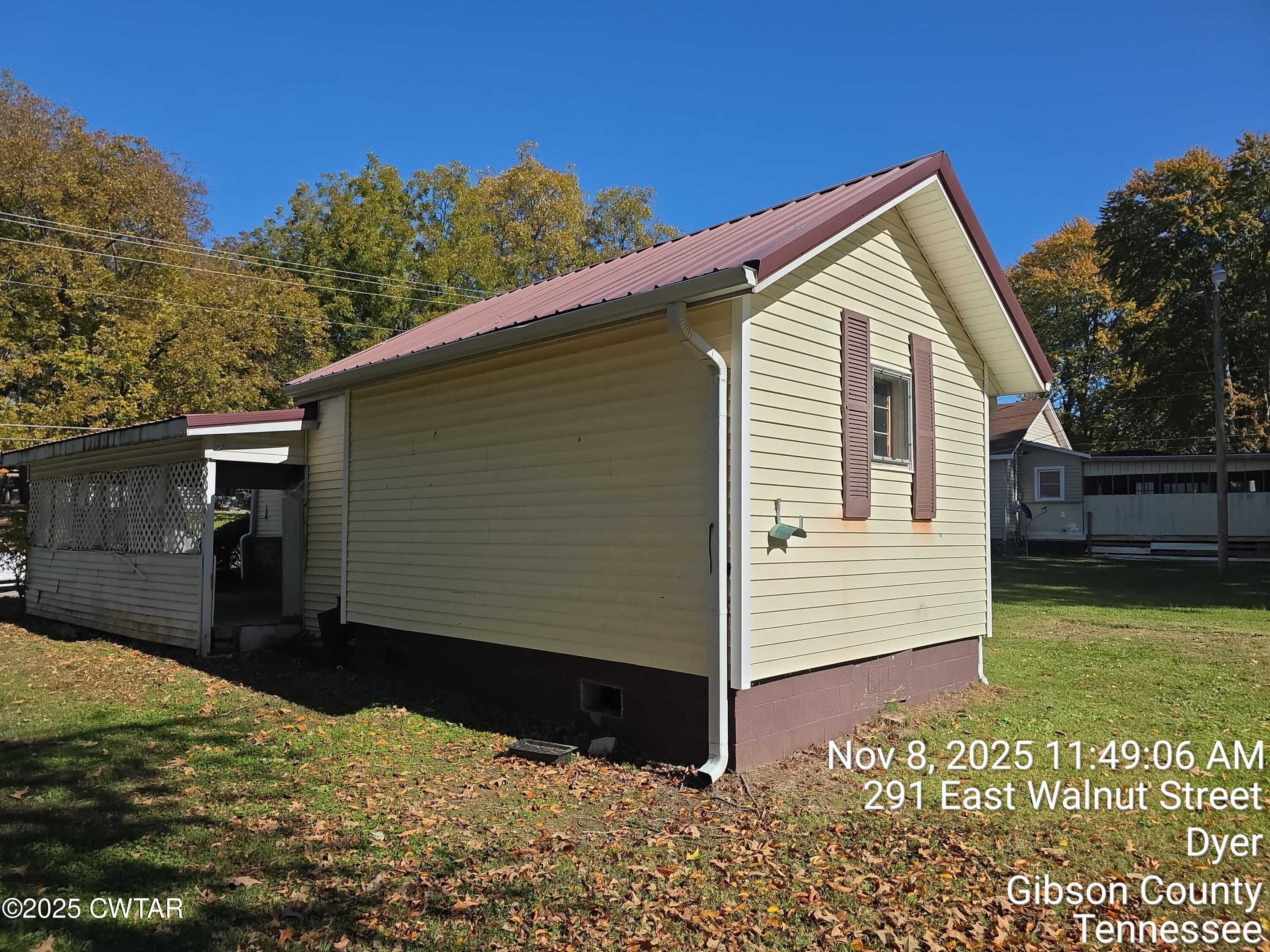 299 East Walnut Street Dyer, TN 38330 - Photo 9 of 41 a view of a house with a yard