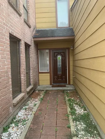 a view of a pathway besides a house