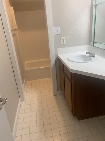 a bathroom with a sink a vanity and a mirror