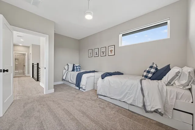 a large white bed in a white room