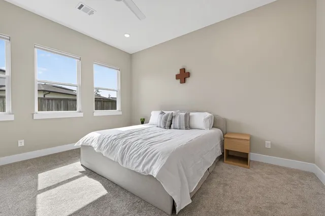 a living room with a couch and wooden floor
