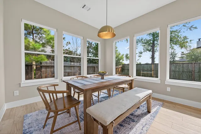 a view of room with wooden floor