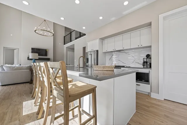 a view of livingroom and dining room with wooden floor