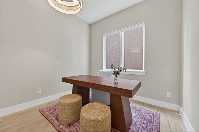 a bedroom with bed and a window