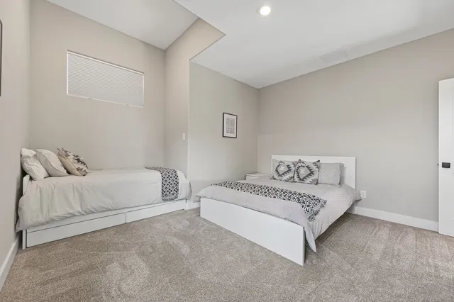 a kitchen with a sink cabinets and wooden floor
