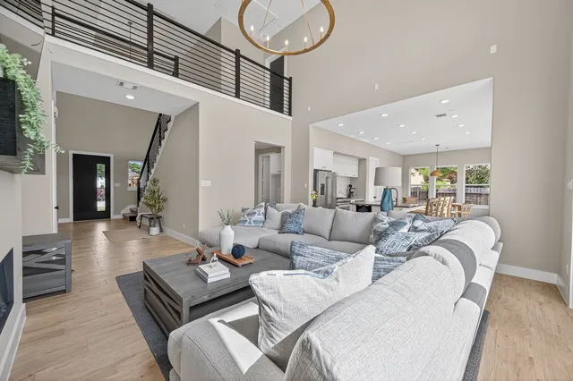 a view of a dining room with furniture and a large window