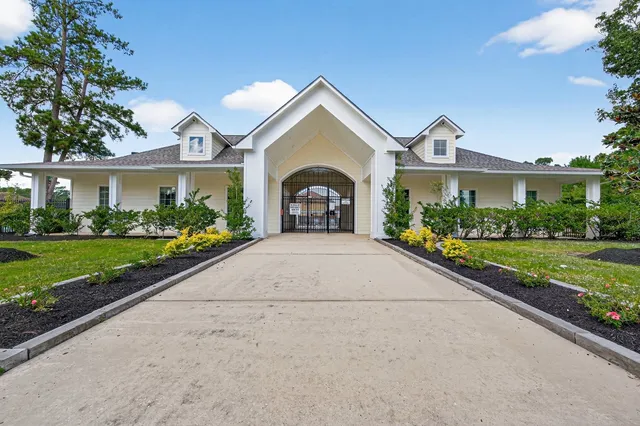 an aerial view of a house with a swimming pool