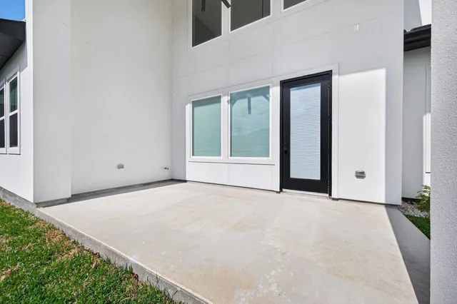 a kitchen with counter top space sink and wooden floor
