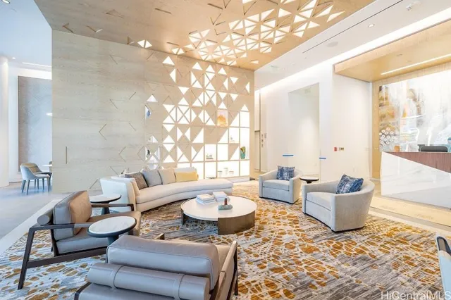 a living room with furniture and a potted plant