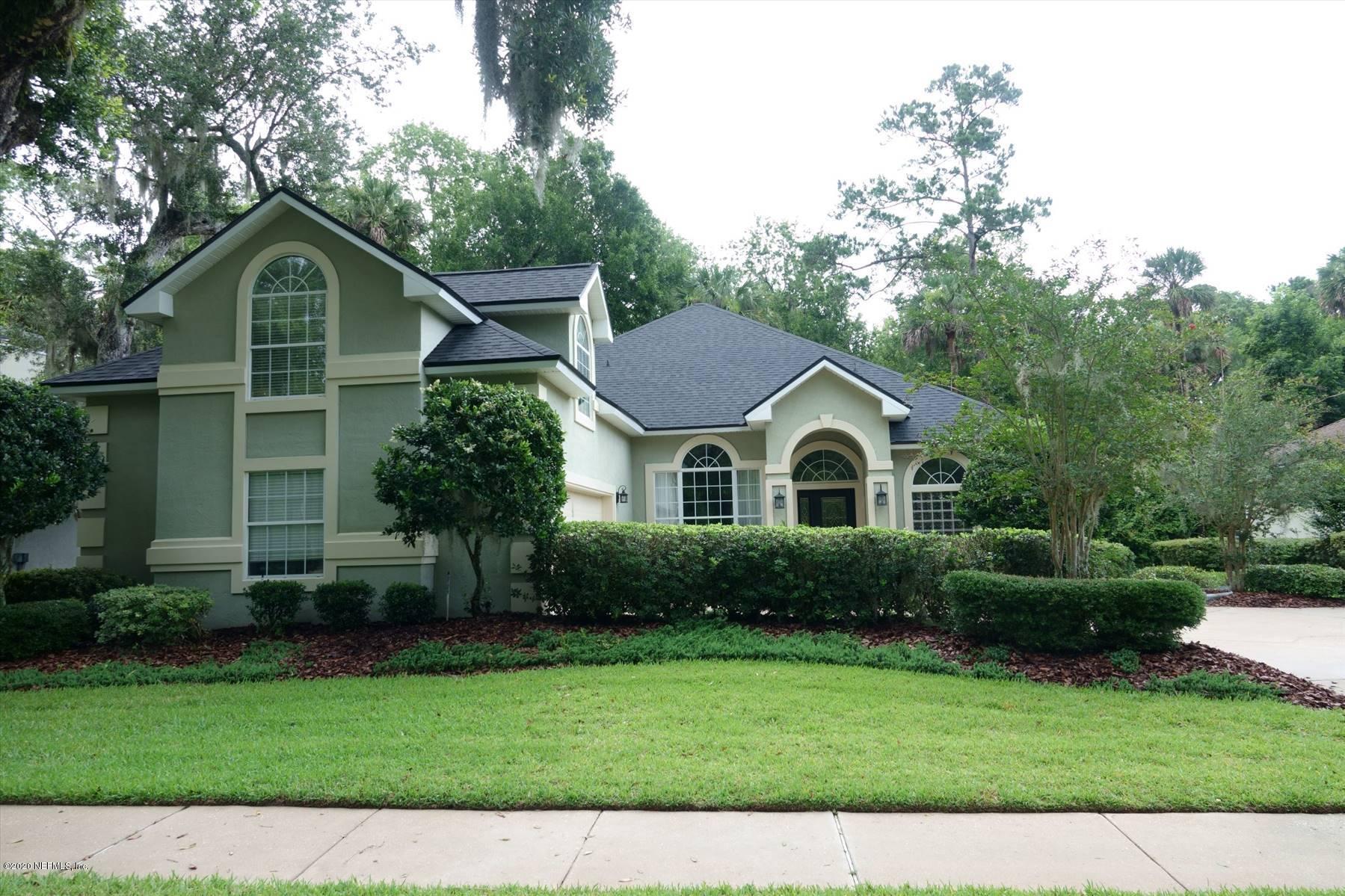 732 Mill Stream Road Ponte Vedra Beach, FL 32082 - Photo 1 of 19 a front view of a house with garden