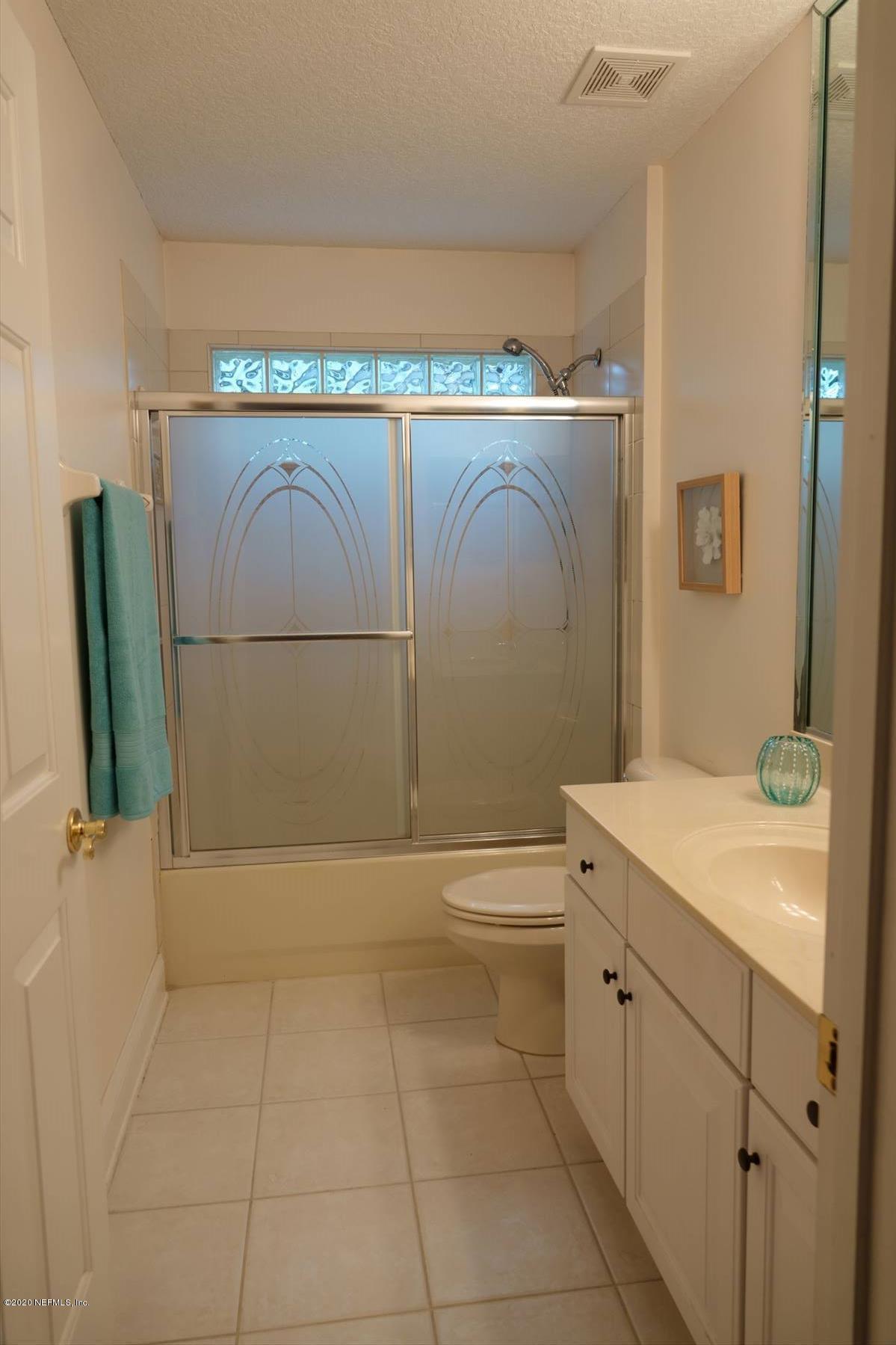 732 Mill Stream Road Ponte Vedra Beach, FL 32082 - Photo 17 of 19 a bathroom with a sink a toilet and shower