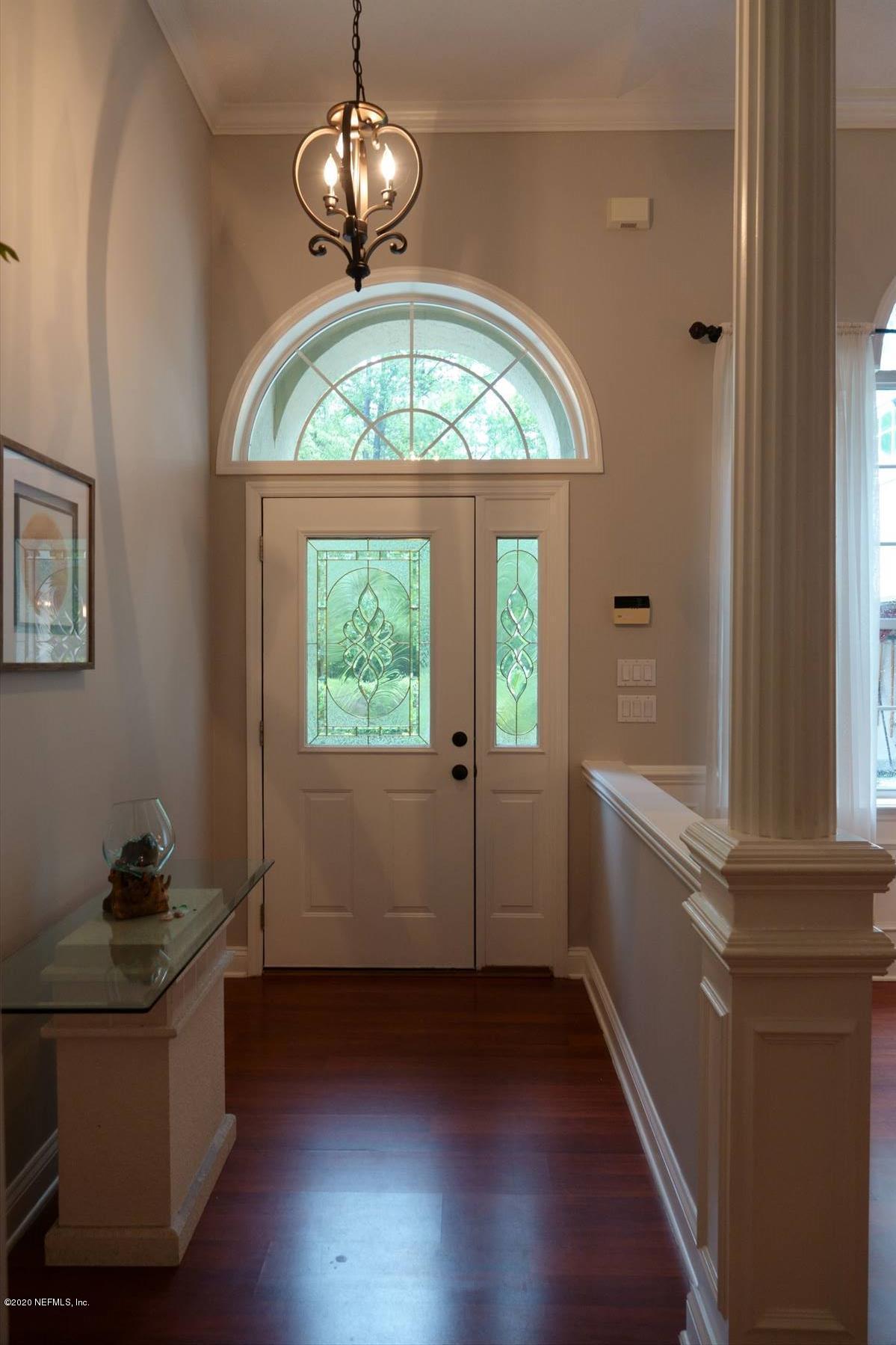732 Mill Stream Road Ponte Vedra Beach, FL 32082 - Photo 3 of 19 wooden floor in an empty room with a window