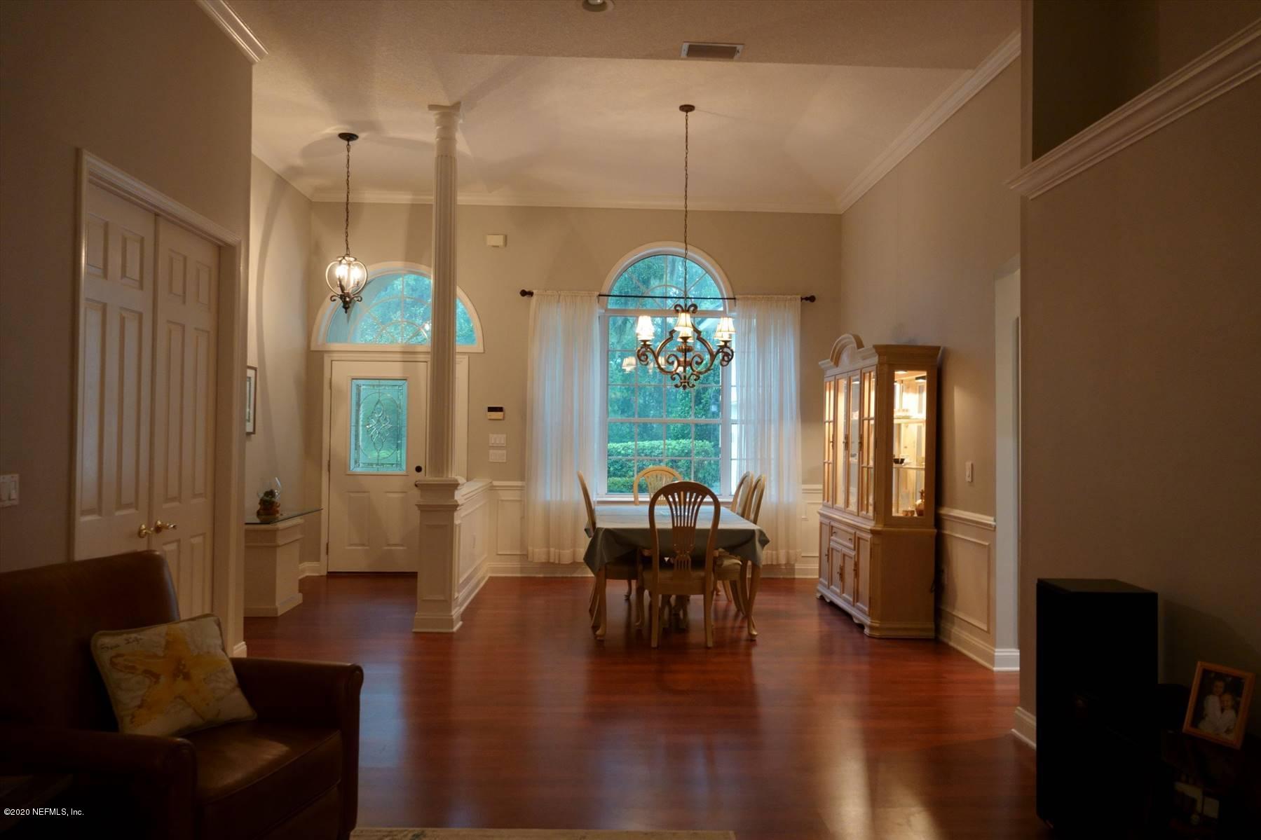 732 Mill Stream Road Ponte Vedra Beach, FL 32082 - Photo 4 of 19 a dining room with furniture window wooden floor and a chandelier