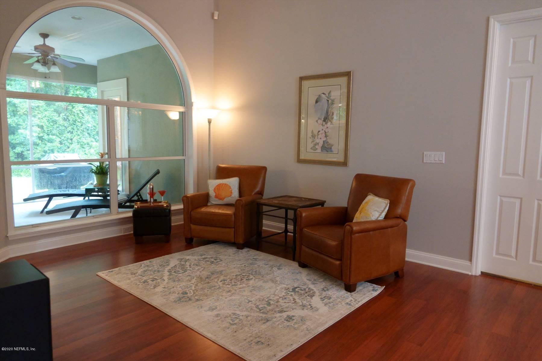 732 Mill Stream Road Ponte Vedra Beach, FL 32082 - Photo 5 of 19 a living room with furniture and a large window