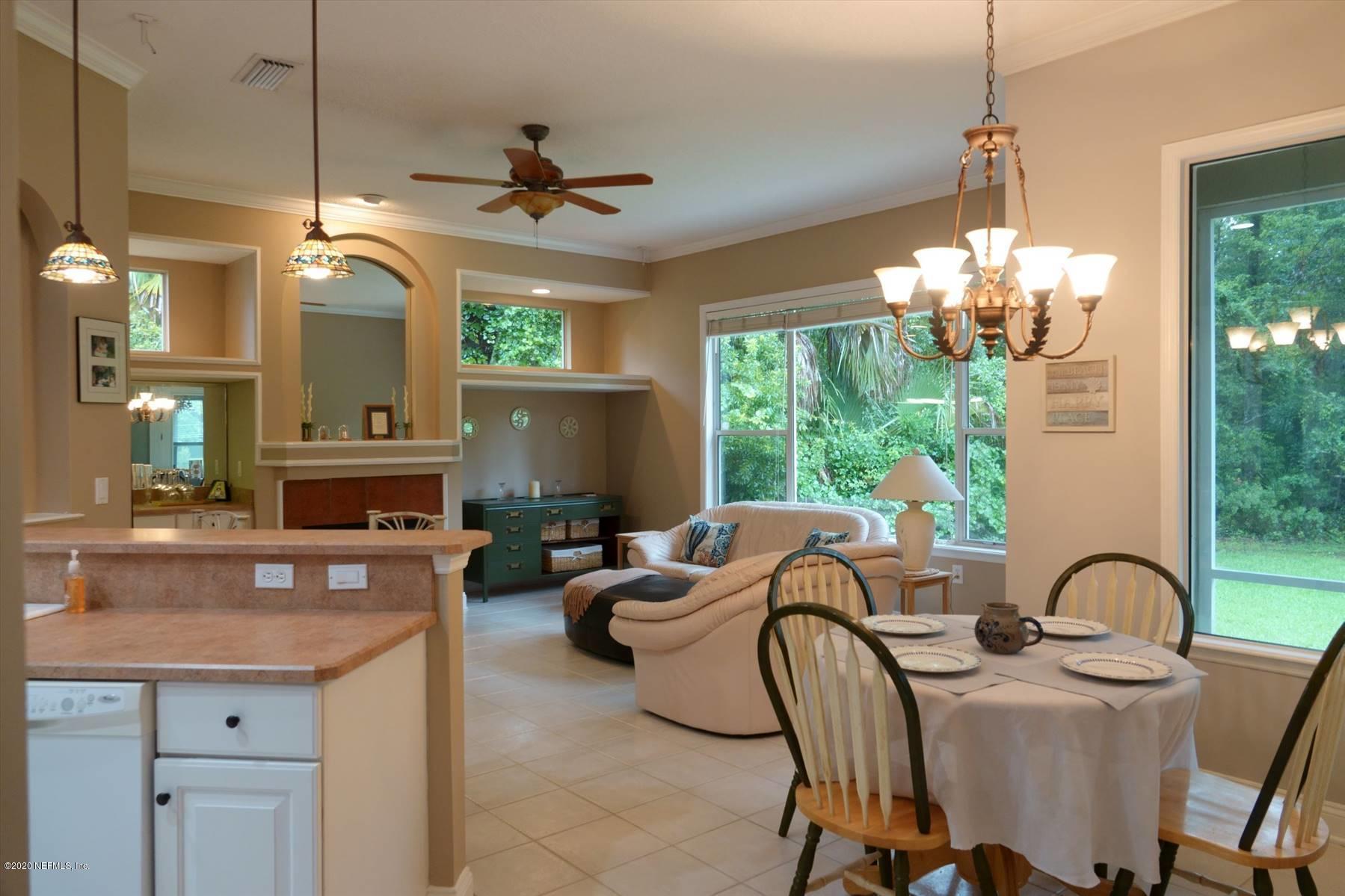 732 Mill Stream Road Ponte Vedra Beach, FL 32082 - Photo 9 of 19 a living room with fireplace furniture and a chandelier