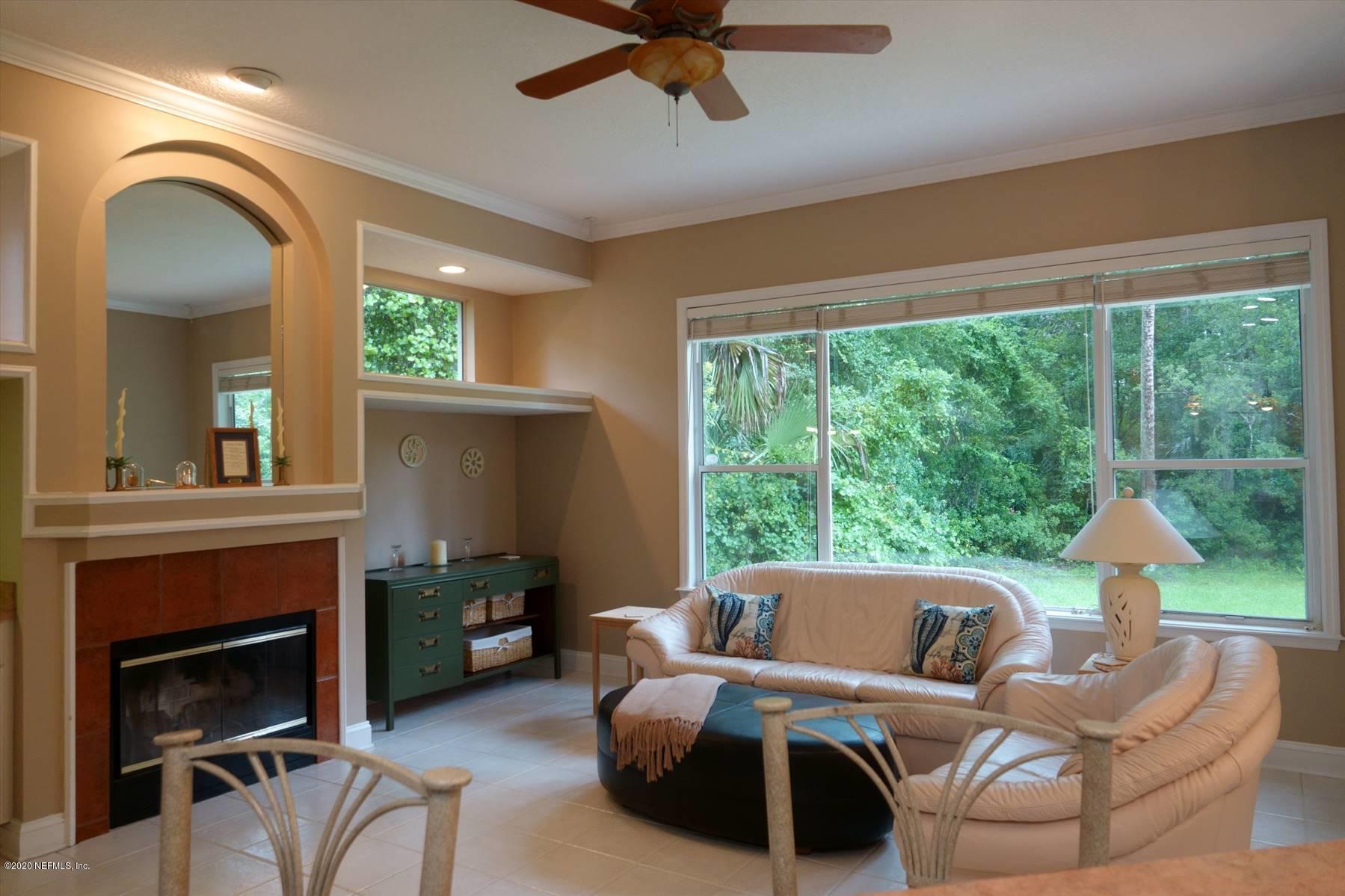 732 Mill Stream Road Ponte Vedra Beach, FL 32082 - Photo 10 of 19 a living room with furniture and a fireplace