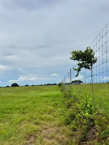 a view of a lake with a big yard