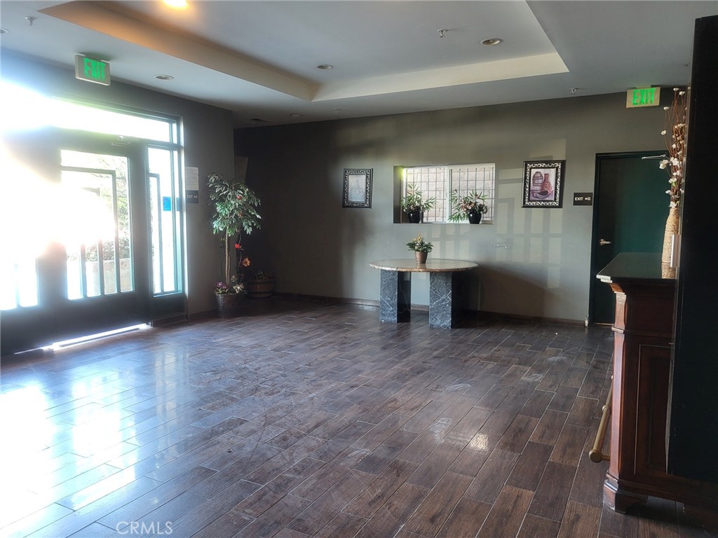 13190 Bromont Avenue, Unit 315 Sylmar, CA 91342 - Photo 2 of 10 a view of livingroom with furniture and window
