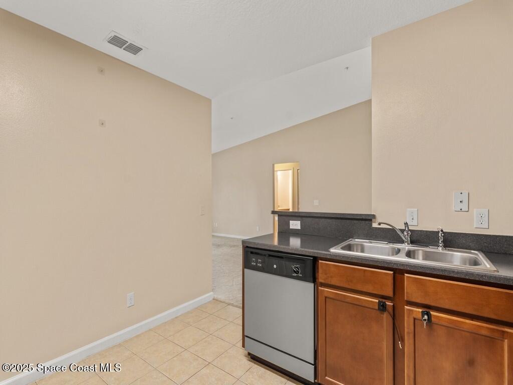 4026 Meander Place, Unit 208 Rockledge, FL 32955 - Photo 13 of 32 a room with sink and mirror