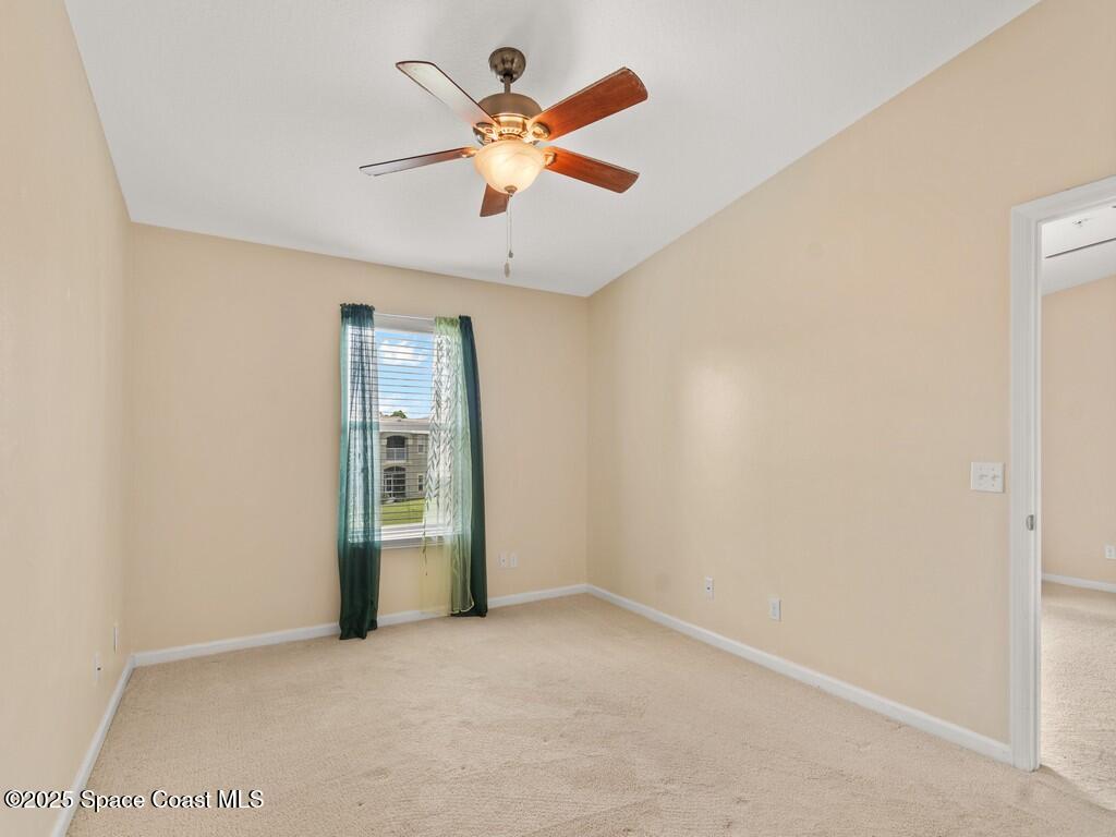 4026 Meander Place, Unit 208 Rockledge, FL 32955 - Photo 15 of 32 an empty room with closet and fan